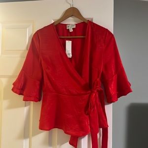 Beautiful never used peplum wrap blouse